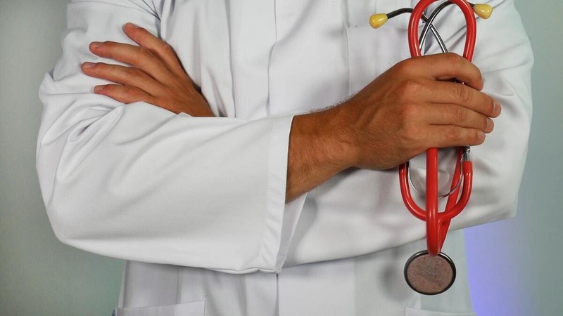 a doctor with his arms crossed